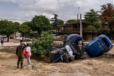Boy rescued after spending the night clinging to a tree to escape deadly flooding in Spain